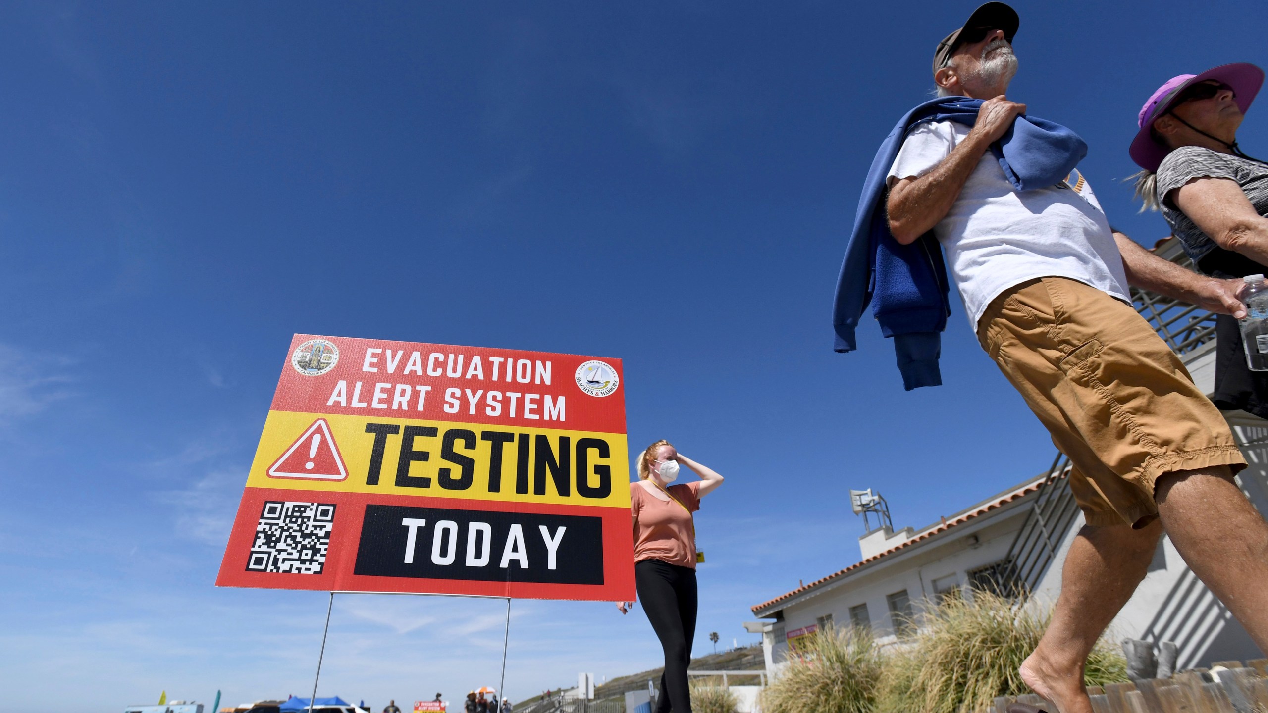 A testing sign for a new beach evacuation alert system is displayed Torrance Beach in Torrance, Calif., on Thursday, April 29, 2021. (Brittany Murray/The Orange County Register via AP)
