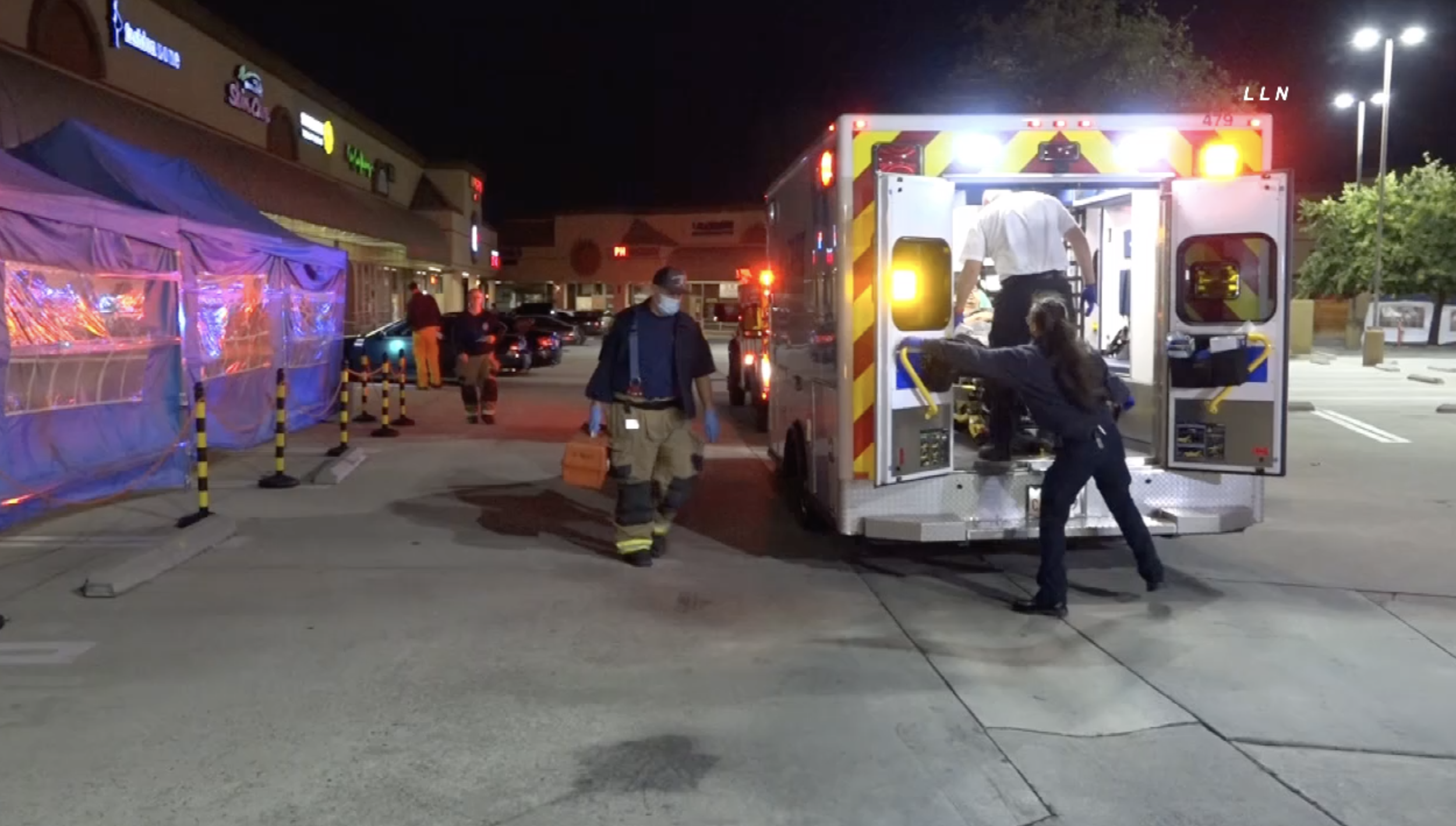 A victim is transported in an ambulance in Diamond Bar after a shooting nearby, on the 60 Freeway, on May 2, 2021. (Loudlabs)