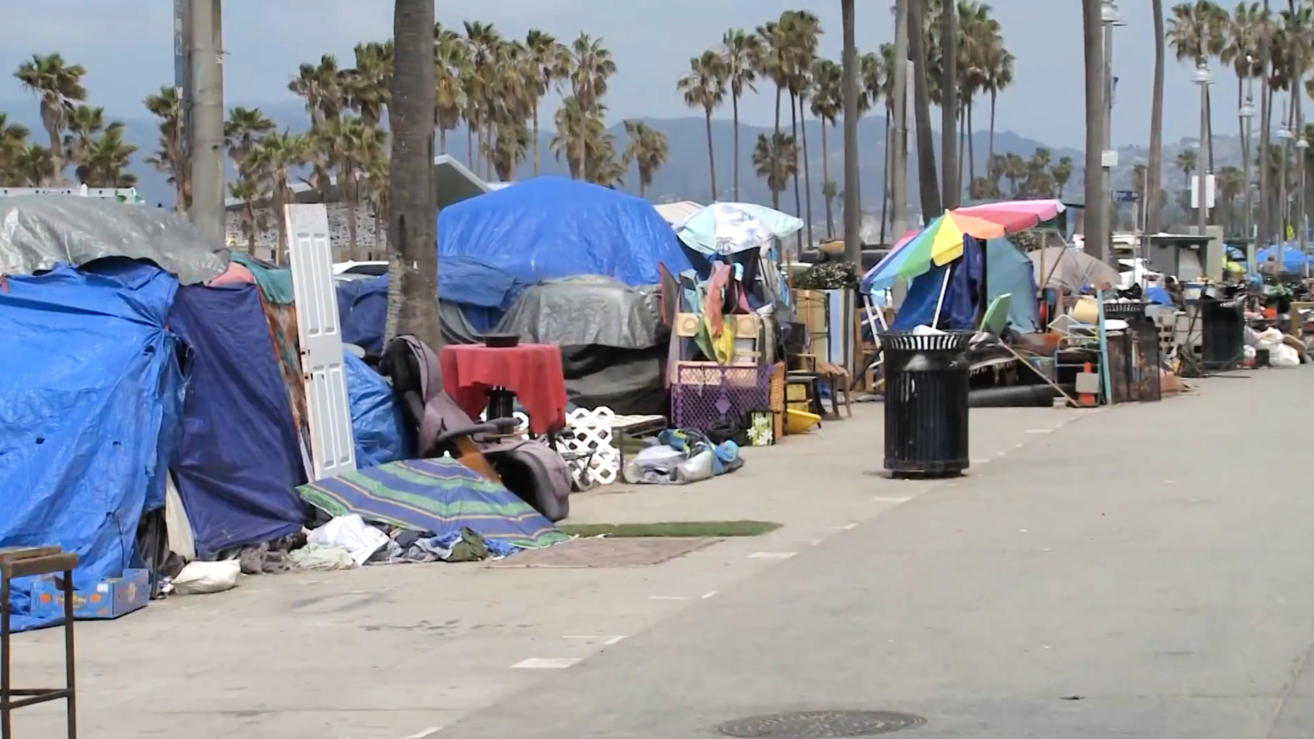 A homeless encampment stretching across the Venice Beach Boardwalk is seen in May 2021. (KTLA)