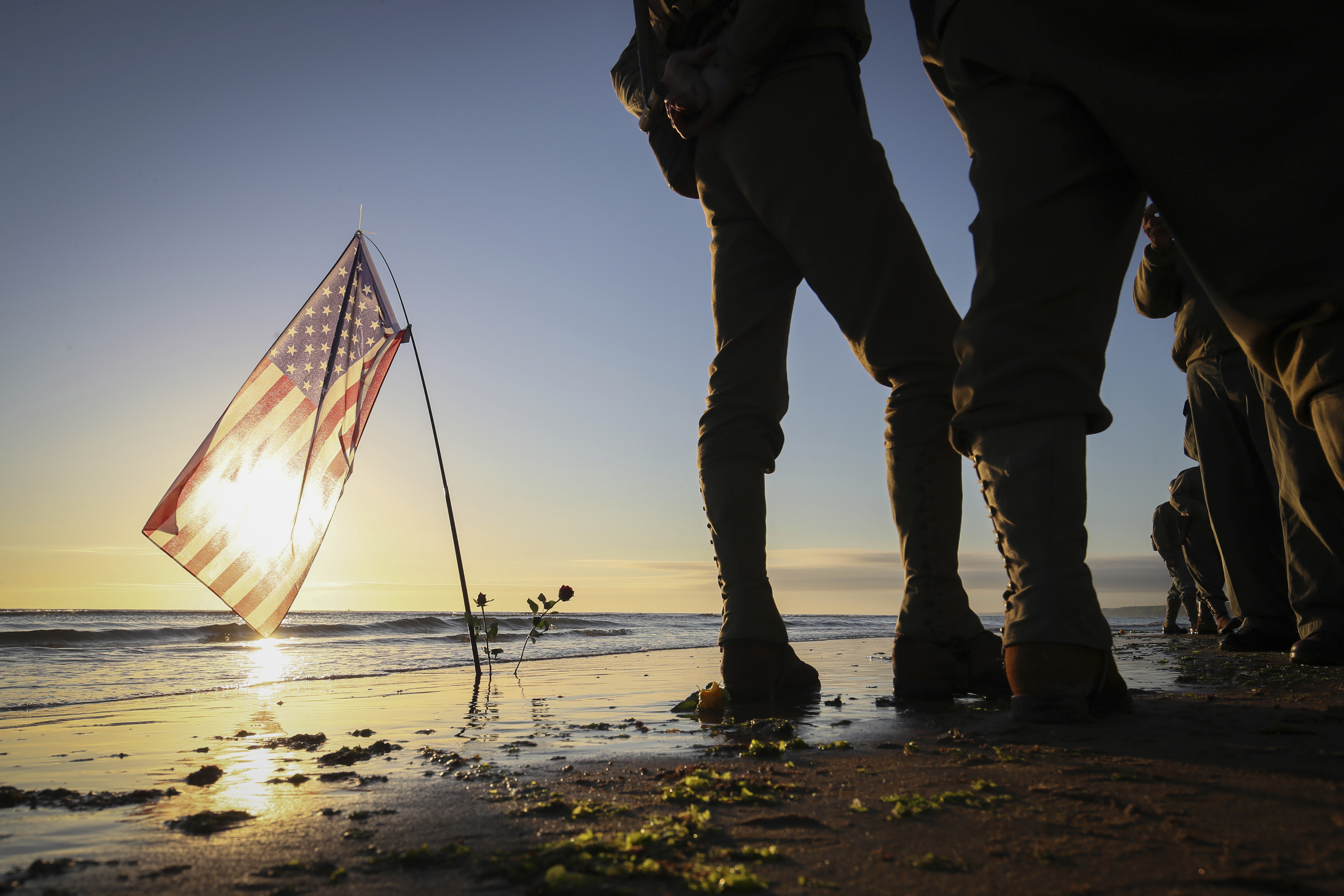 World War II reenactors gather on Omaha Beach in Saint-Laurent-sur-Mer, Normandy, Sunday, June 6, 2021, the day of 77th anniversary of the assault that helped bring an end to World War II. (AP Photo/David Vincent)