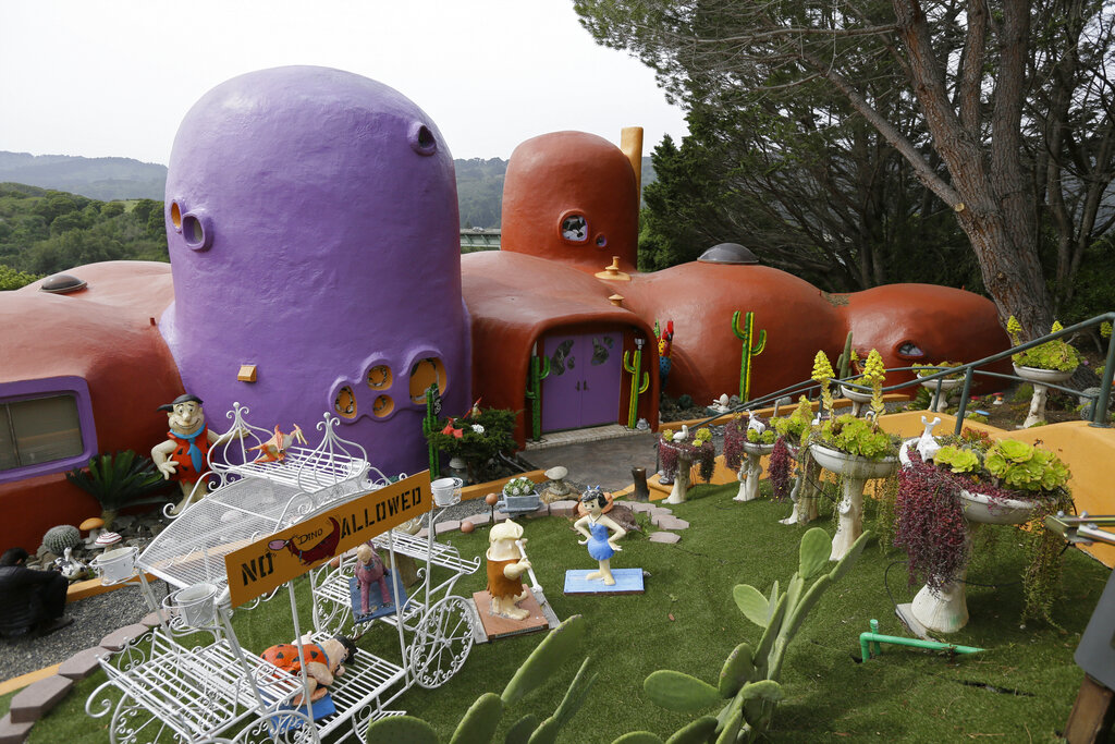 In this Thursday, April 11, 2019, file photo, The Flintstone House is seen before a news conference with the owner and the home's original architect in Hillsborough, California. (AP Photo/Eric Risberg, File)