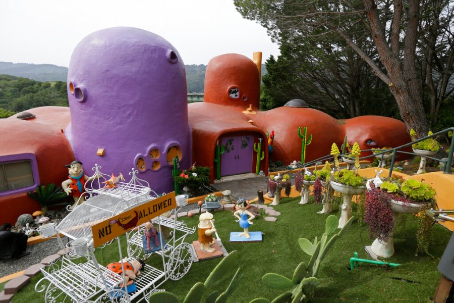 In this Thursday, April 11, 2019, file photo, The Flintstone House is seen before a news conference with the owner and the home's original architect in Hillsborough, California. (AP Photo/Eric Risberg, File)