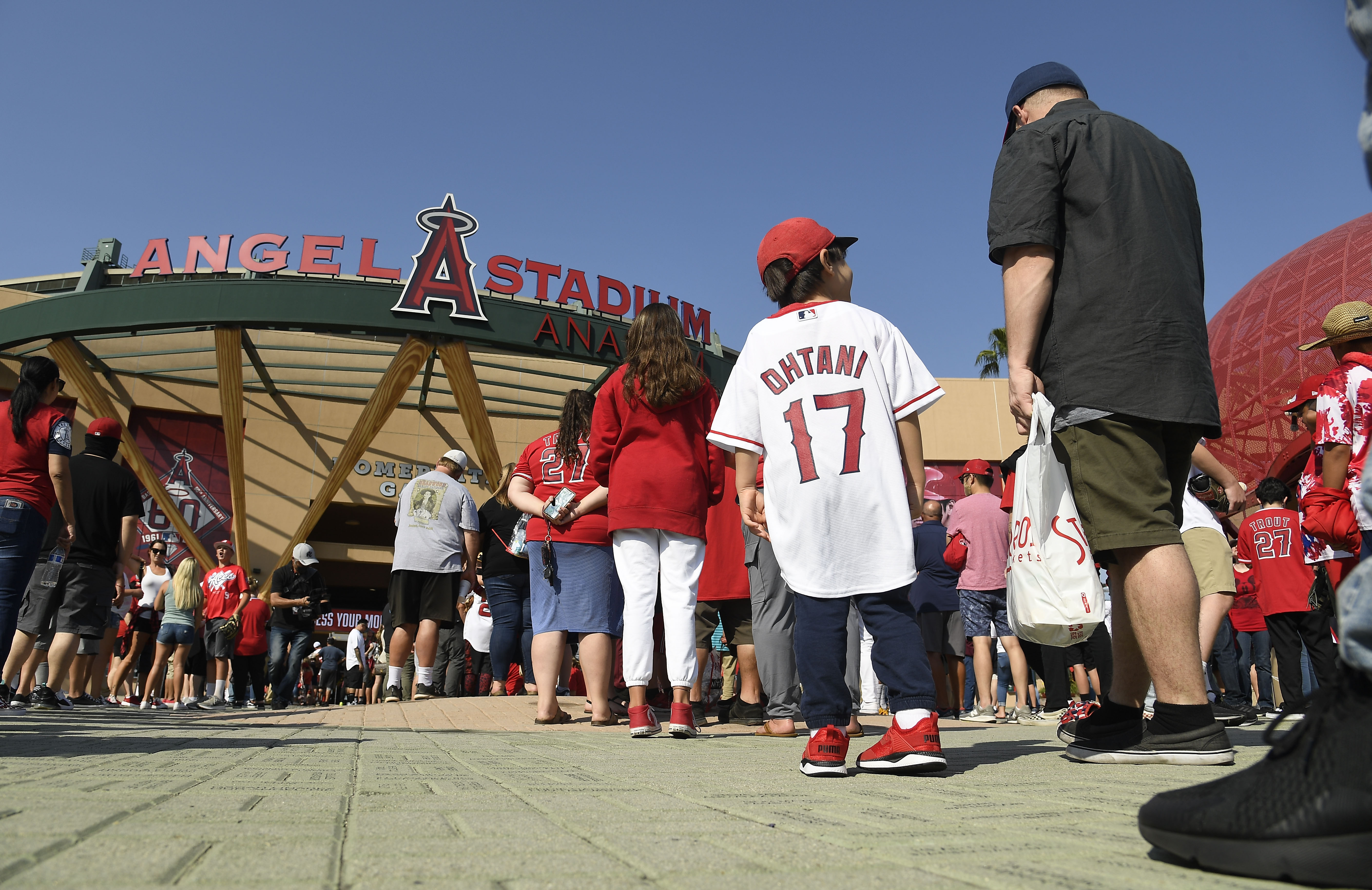 Fans wait to enter Angel Stadium in Anaheim for a baseball game between the Detroit Tigers and Los Angeles Angels on June 17, 2021, the venue’s first full capacity game since the start of the coronavirus pandemic. (Kevork Djansezian / Getty Images)
