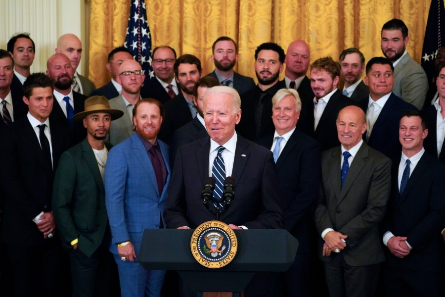 President Joe Biden praised sports' ability to heal and bring a nation together in a time of crisis as he hosted the World Series champion Los Angeles Dodgers at the White House on Friday. The Dodgers, who captured the title by defeating the Tampa Bay Rays last October, were the first team to be honored at the White House since the onset of the COVID-19 pandemic and the first since Biden took office. “I think what we discovered is that we need sports more than we ever realized,” said Biden, who praised baseball as an important totem of normalcy in “one of the most challenging years” in the nation's history. The president saluted the Dodgers as “a lot more than a baseball club, they are a pillar of American culture.” He also praised the team for using its stadium as a mass COVID-19 vaccination site. The ceremony marked the latest step in the White House’s efforts to return to large in-person events as it seeks to highlight the nation’s emergence from the pandemic. More than 50 members of the team attended the East Room event as well as a number of political heavyweights with California ties, including Vice President Kamala Harris, House Republican Leader Kevin McCarthy and Los Angeles Mayor Eric Garcetti. Biden kept the mood light, teasing that he didn't want to dwell on the fact that Harris roots for the Dodgers' long-standing rival, the San Francisco Giants. He also told stories about his own exploits in a congressional baseball game, saying he hit a ball off the wall that thrilled his sons more than any of his political accomplishments. Clayton Kershaw, the team’s future Hall of Fame pitcher, presented Biden with what has become the standard gift: a jersey emblazoned on the back with the president’s name and number. Biden, the 46th commander in chief, joked that he was demonstrating that he was “a man of courage” by holding the jersey up because he risked incurring the wrath of First Lady Jill Biden, a rabid Philadelphia Phillies fan. The jubilant ceremony bore few of the political overtones that became a hallmark of teams' visits during the presidency of Donald Trump. Some champions, like the Golden State Warriors and Philadelphia Eagles, skipped being honored at the White House. Others, like the New England Patriots and Boston Red Sox, only sent limited delegations, with many players opting to stay home. Pitcher Trevor Bauer, who has a protection order against him for allegedly assaulting a woman during what he says was consensual sex, did not attend the event. He has denied the allegations. The Dodgers, who are in town for a four-game series with the Washington Nationals, said only members of the 2020 World Series team would attend, and Bauer didn’t sign with the team until this year. Later Friday, the reigning NL Cy Young Award winner was placed on seven-day administrative leave by Major League Baseball. Mookie Betts, the star outfielder for the 2018 champion Red Sox, did not make that team's trip to the White House. But Betts, now on the Dodgers, did attend Friday. Trump also became known for serving fast food to the teams that did visit the executive mansion; details on any meals consumed by the Dodgers at the White House were not immediately released. The 2020 title was the Dodgers’ seventh World Series championship and they are among the favorites again this year, prompting Biden to joke that he may see them again.