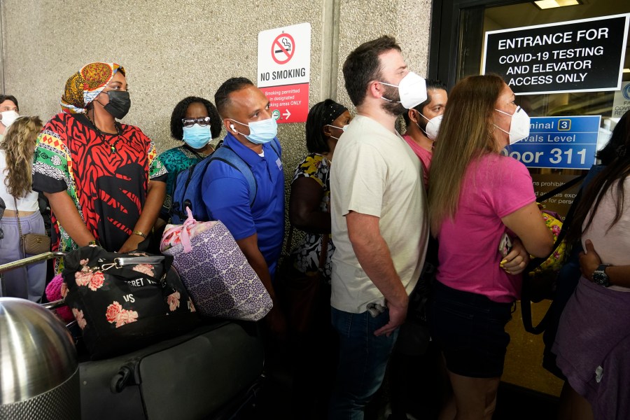Passengers wait in a long line to get a COVID-19 test to travel overseas at Fort Lauderdale-Hollywood International Airport, Friday, Aug. 6, 2021, in Fort Lauderdale, Fla. (AP Photo/Marta Lavandier)