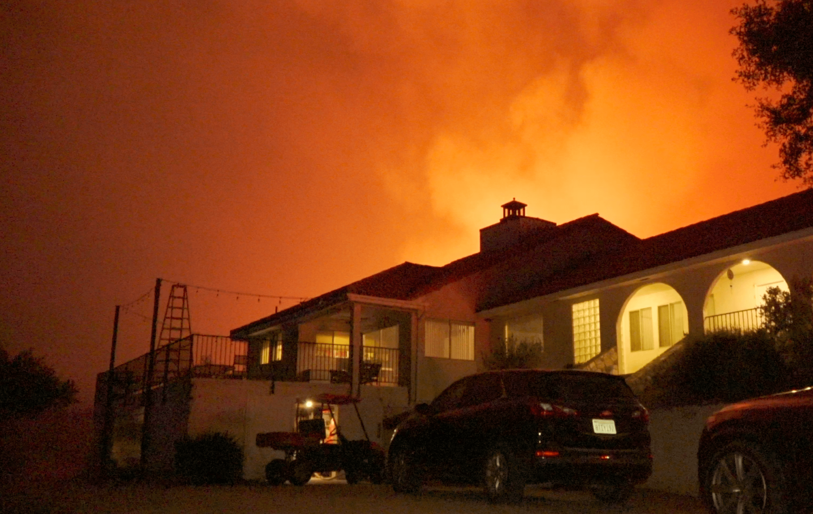 The Chapparal Fire burns behind a home near the community of La Cresta on Aug. 29, 2021. (Onscene.TV)