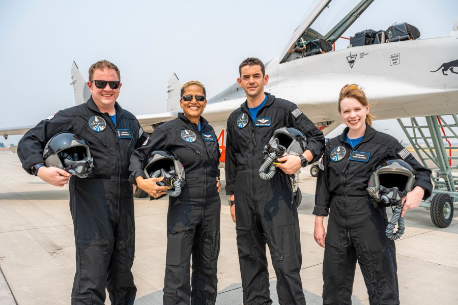 In this Aug. 8, 2021, photo provided by John Kraus, from left, Chris Sembroski, Sian Proctor, Jared Isaacman and Hayley Arceneaux stand for a photo in Bozeman, Mont., during a "fighter jet training" weekend to familiarize the crew with G-forces. (John Kraus/Inspiration4 via Associated Press)