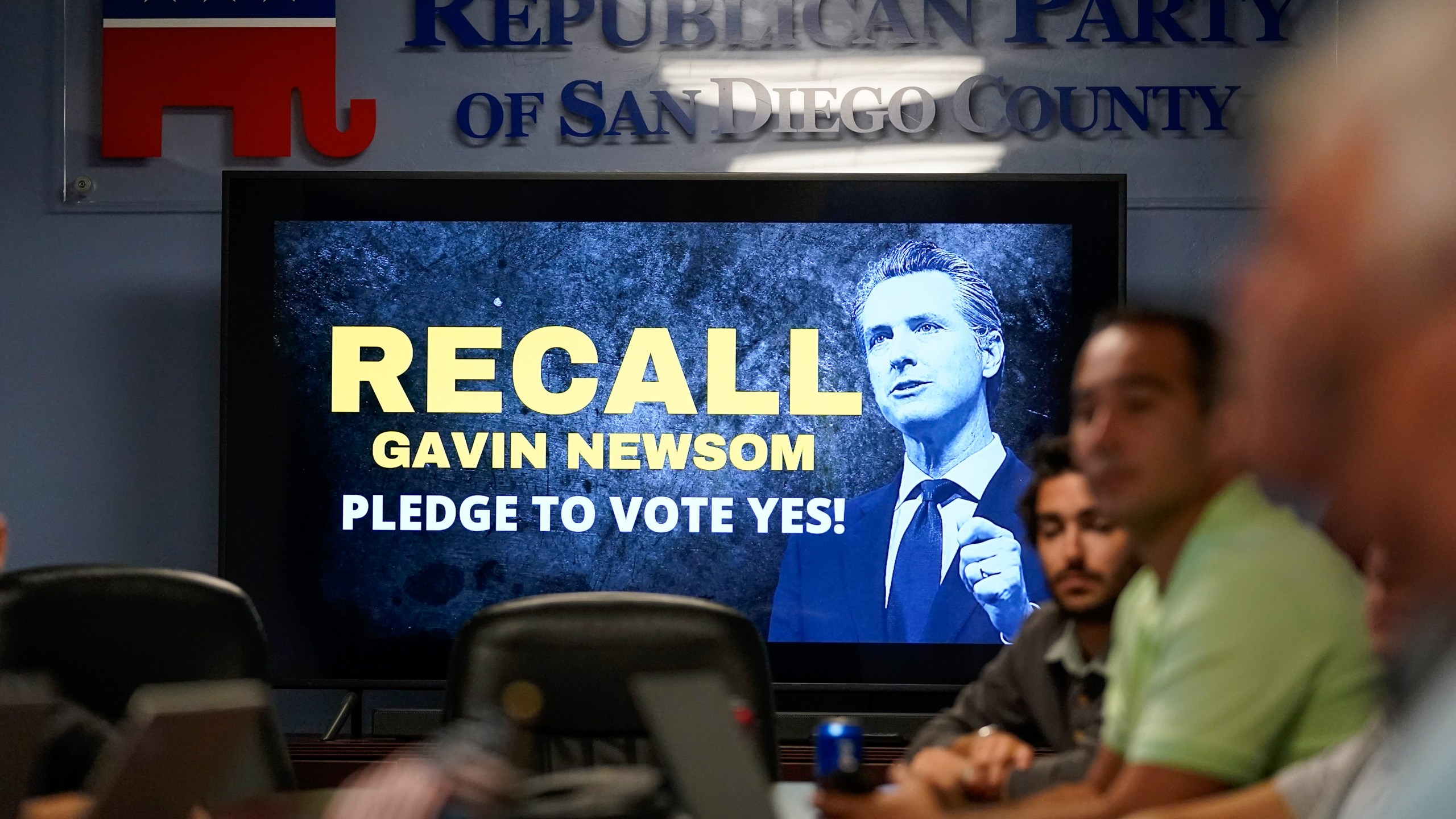People listen during a meeting of volunteers to get out the vote by supporters of the effort to recall California Gov. Gavin Newsom at the San Diego Republican Party Headquarters on Sept. 13, 2021, in San Diego. (AP Photo/Gregory Bull)