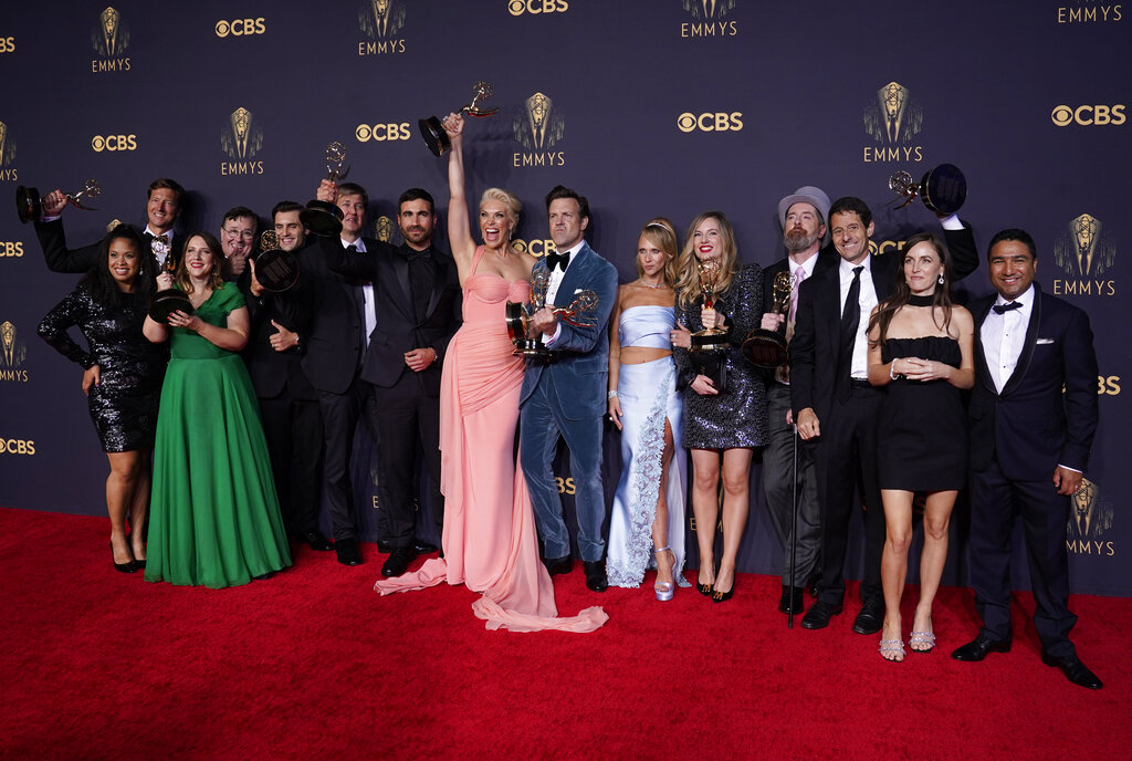 Brett Goldstein, Hannah Waddingham, Jason Sudeikis, Juno Temple and the cast and crew from "Ted Lasso" pose with their awards at the 73rd Primetime Emmy Awards on Sunday, Sept. 19, 2021, at L.A. Live. (AP Photo/Chris Pizzello)
