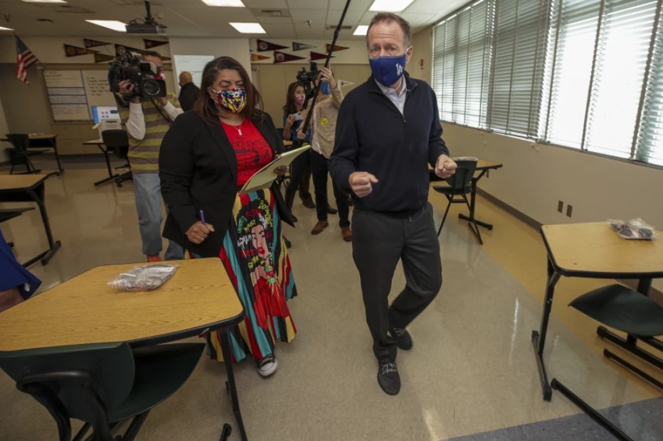 L.A. teachers union President Cecily Myart-Cruz reviews campus-safety measures at Panorama High with then-Supt. Austin Beutner in March. Safety measures were key to the labor pact announced Wednesday by Myart-Cruz and the school district. (Irfan Khan / Los Angeles Times)