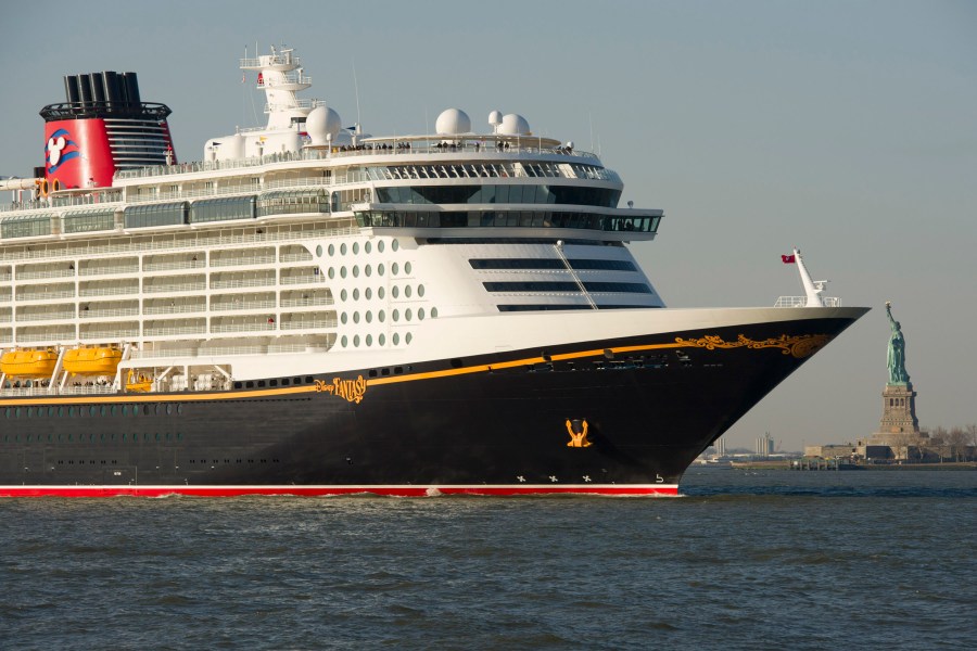 In this handout image provided by Disney Parks, DISNEY CRUISE LINE MAKES INAUGURAL VISIT TO NEW YORK: the Disney Fantasy, the newest ship of Disney Cruise Line ship, sails past the Statue of Liberty after traveling nearly 3,800 miles across the Atlantic Ocean from Bremerhaven, Germany. (David Roark/Disney Parks via Getty Images)