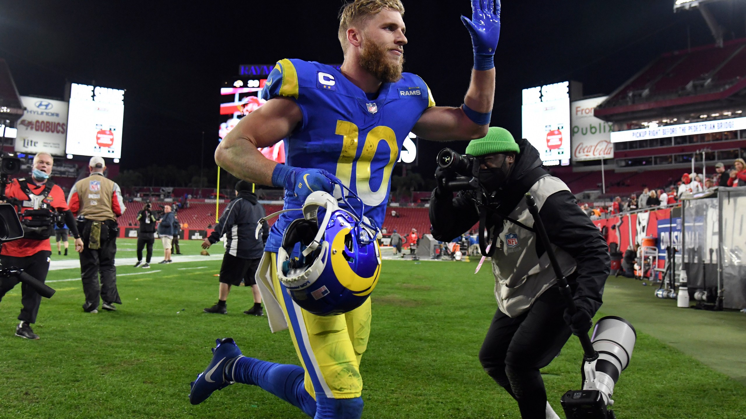 Los Angeles Rams wide receiver Cooper Kupp (10) celebrates as he leaves the field after the team defeated the Tampa Bay Buccaneers during an NFL divisional round playoff football game Sunday, Jan. 23, 2022, in Tampa, Fla. (AP Photo/Jason Behnken)