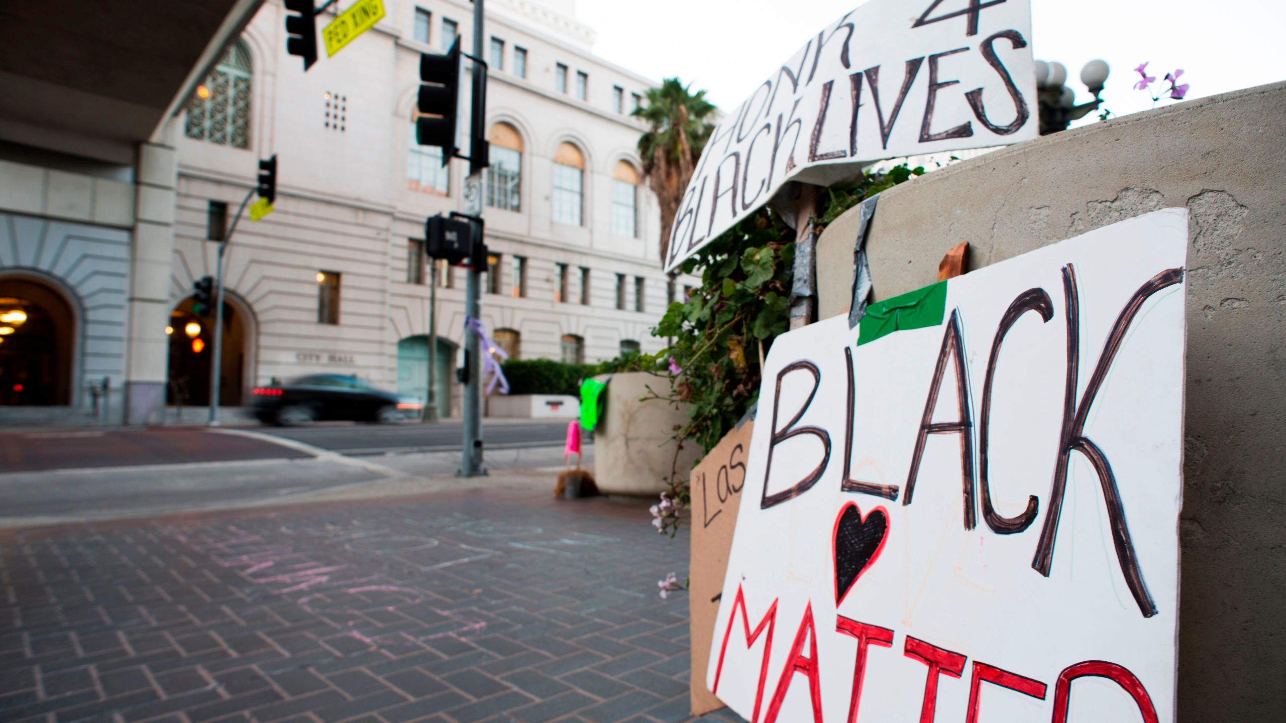 A sign reading "Honk 4 Black Lives" is seen at an encampment of activists associated with the Black Lives Matter movement, outside Los Angeles City Hall on Aug. 13, 2016. (ROBYN BECK/AFP via Getty Images)