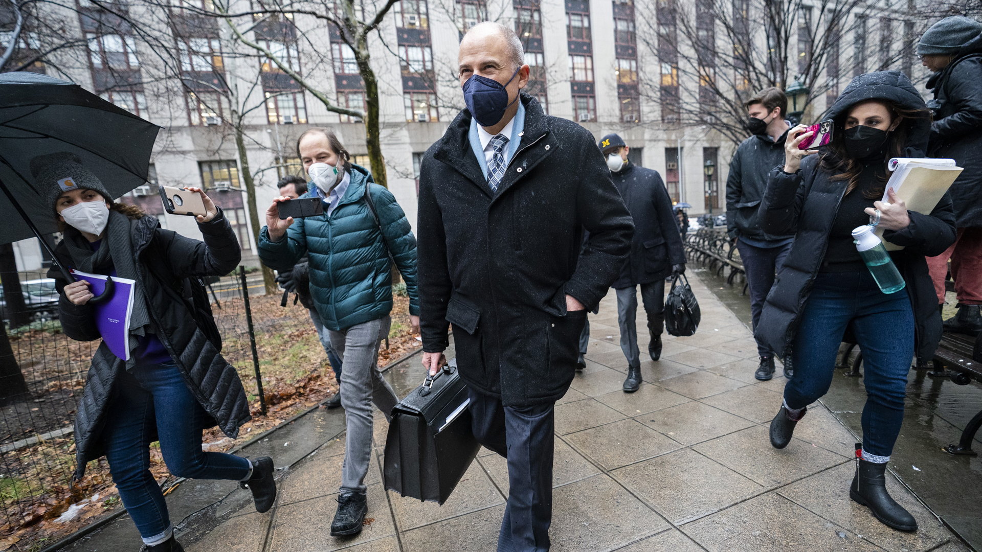 Michael Avenatti leaves federal court with members of the media in tow on Feb. 4, 2022, in New York. (John Minchillo/Associated Press)