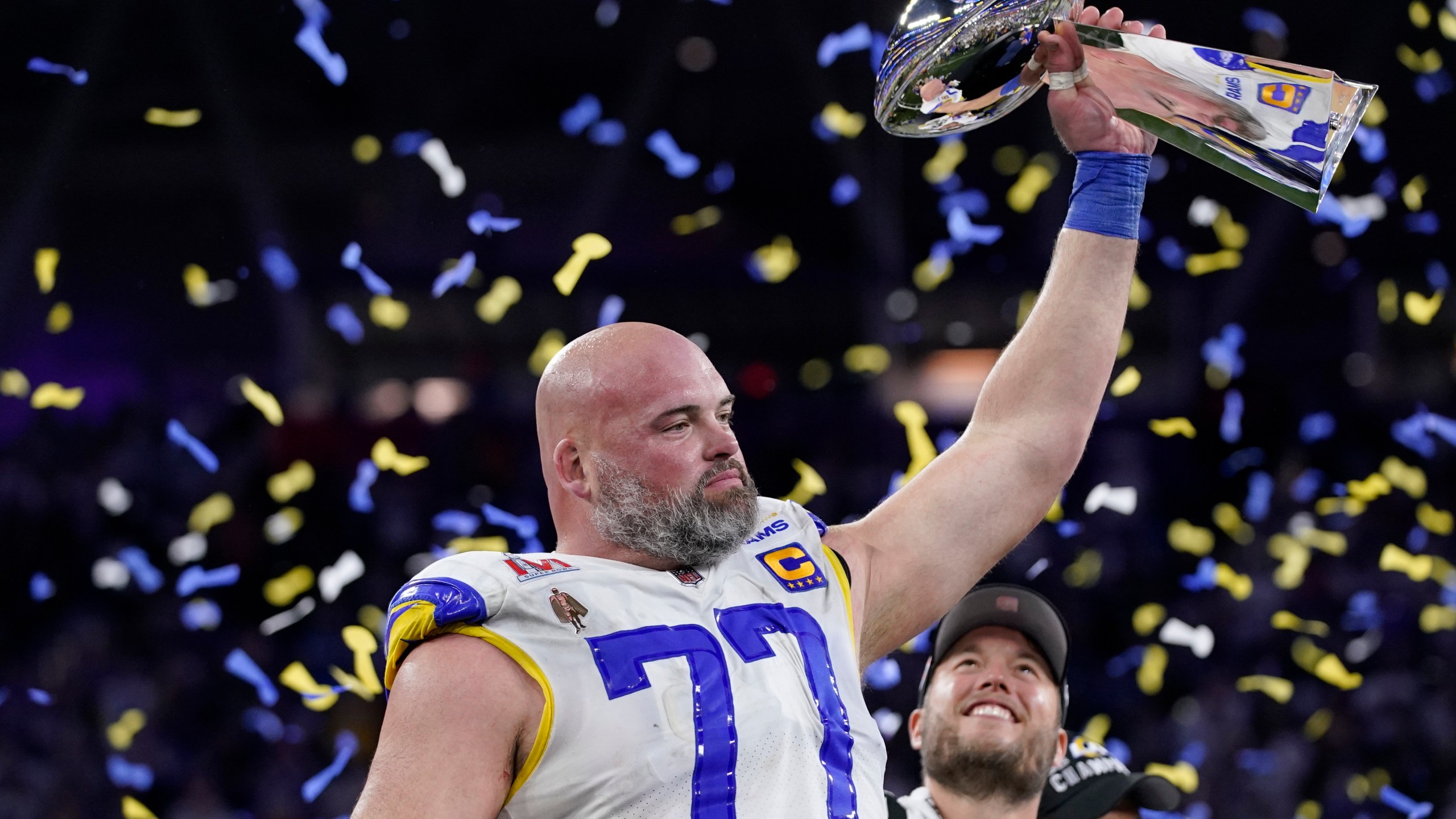 Los Angeles Rams offensive tackle Andrew Whitworth (77) holds up the Lombardi Trophy after the Rams defeated the Cincinnati Bengals in the NFL Super Bowl 56 football game Sunday, Feb. 13, 2022, in Inglewood, Calif. (AP Photo/Mark J. Terrill)