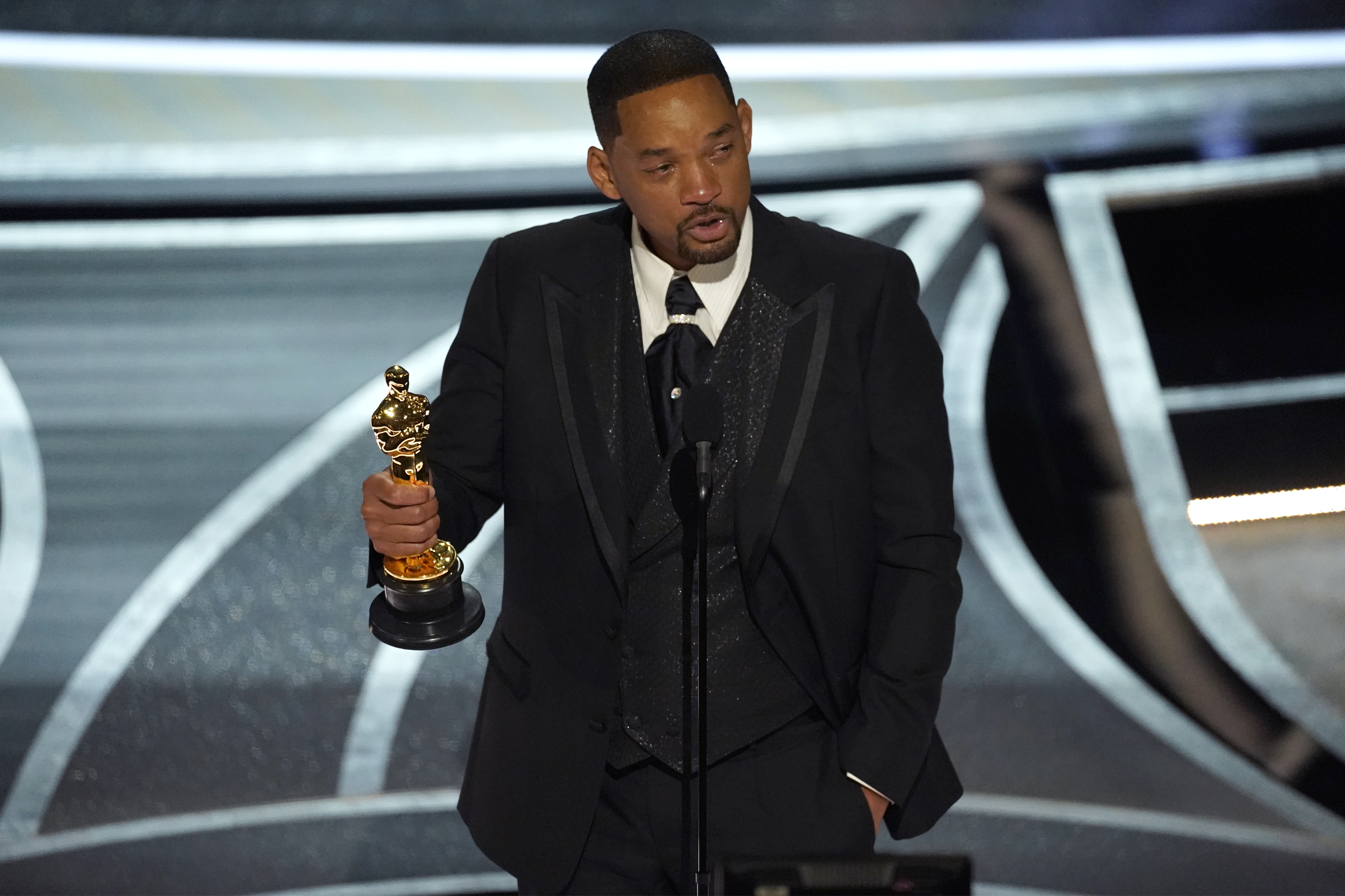Will Smith cries as he accepts the award for best performance by an actor in a leading role for "King Richard" at the Oscars on March 27, 2022, at the Dolby Theatre in Los Angeles. (Chris Pizzello/Associated Press)