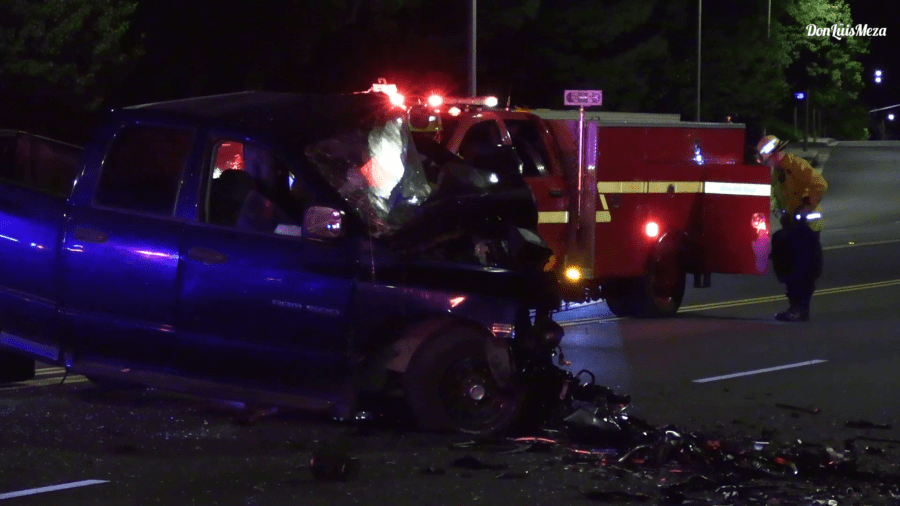 Two pickups are seen heavily damaged following a deadly crash in Palmdale on Sunday, Aug. 7, 2022 (Don Luis Meza)