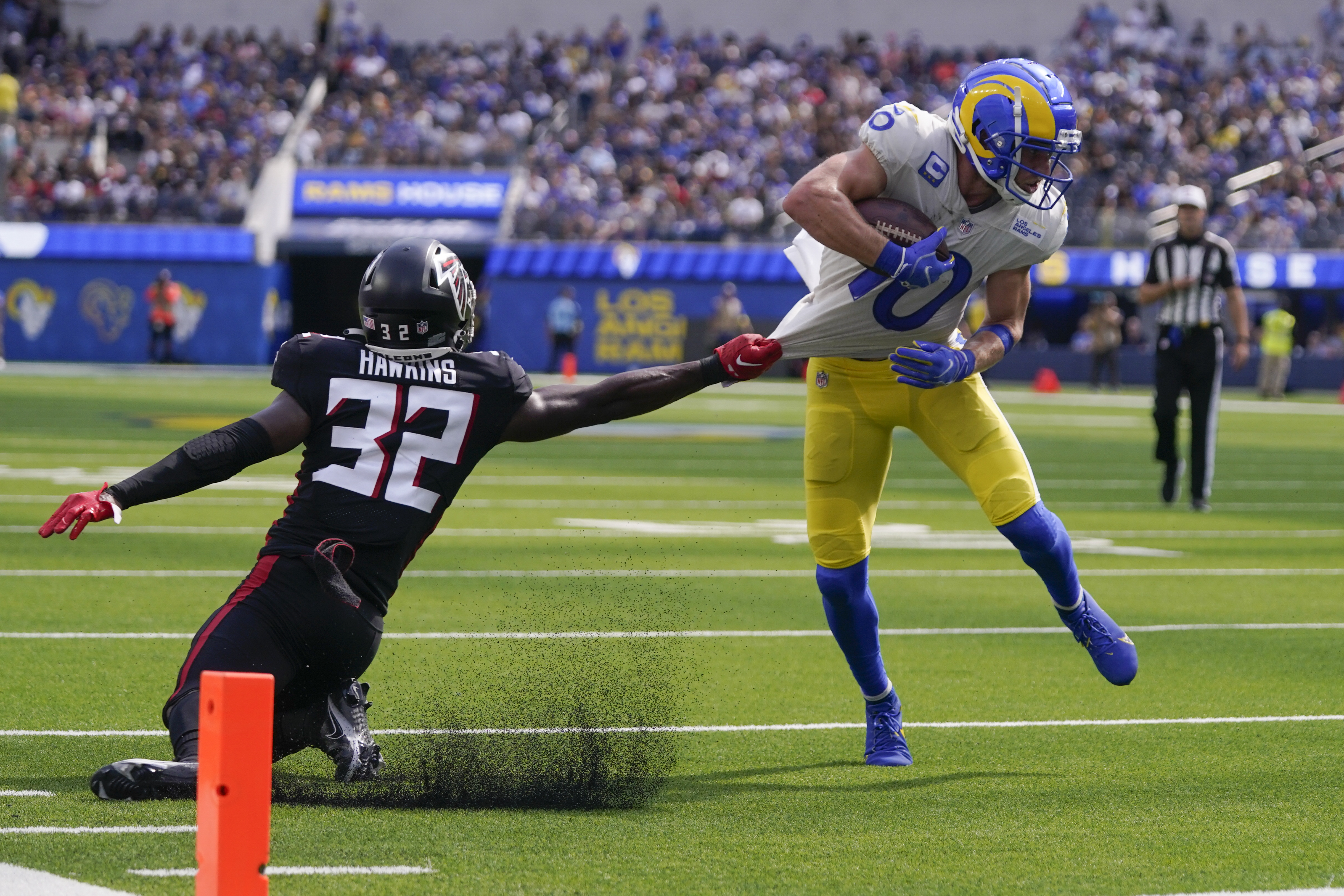 Los Angeles Rams wide receiver Cooper Kupp, right, gets away from Atlanta Falcons safety Jaylinn Hawkins as he scores a touchdown during the second half of an NFL football game Sunday, Sept. 18, 2022, in Inglewood, Calif. (AP Photo/Mark J. Terrill)