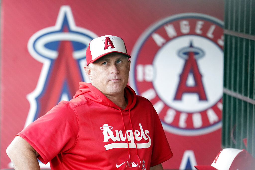 Los Angeles Angels manager Phil Nevin looks on from the dugout before a baseball game against the Oakland Athletics Tuesday, Aug. 2, 2022, in Anaheim. (Marcio Jose Sanchez/Associated Press)