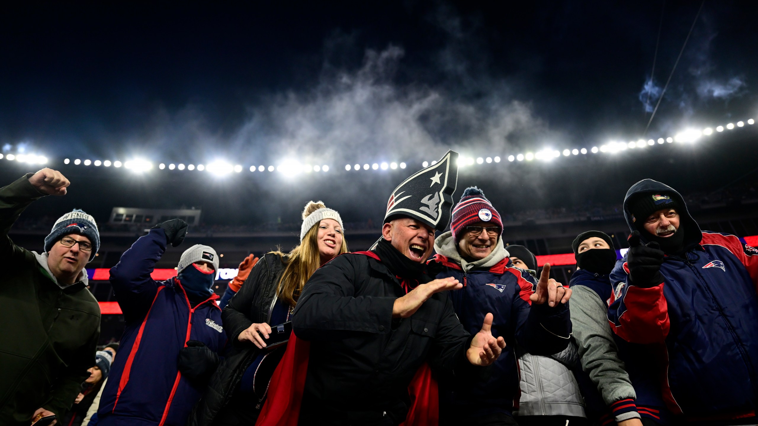 If an NJ.Bet survey is right, these Patriots fans are likely mocking the Buffalo Bills and their supporters on Dec. 1, 2022, in Foxborough, Massachusetts. (Billie Weiss/Getty Images)