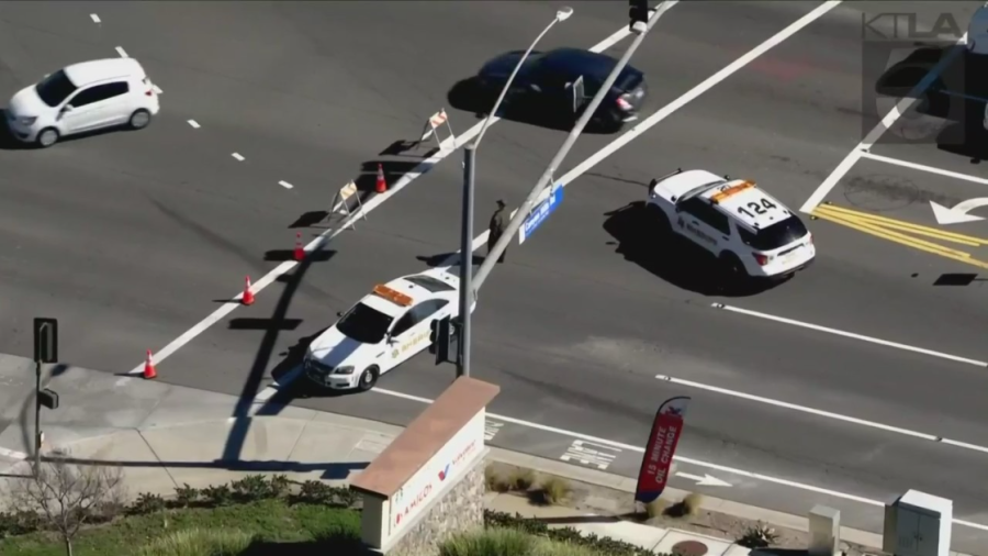 Officials block the area near a fatal crash involving an off-duty Orange County sheriff's deputy in Lake Elsinore on Feb. 9, 2023. (KTLA)