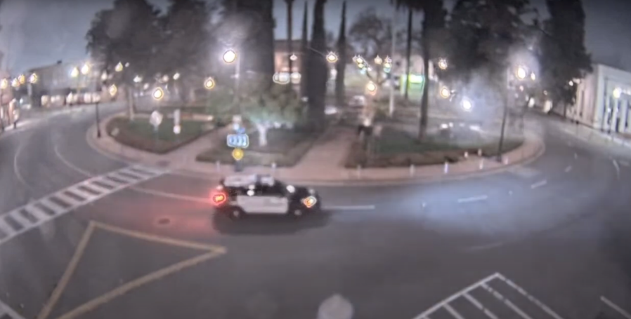 Still photo from City of Orange surveillance footage showing the Hyundai overturning after colliding with the Plaza Park fountain at the end of a police pursuit March 13, 2023.