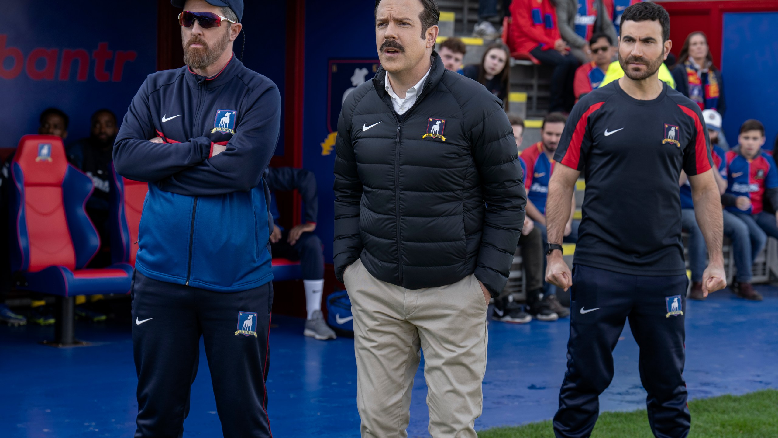 This image released by Apple TV shows Brendan Hunt, from left, Jason Sudeikis and Brett Goldstein in the season three finale episode of "Ted Lasso." (Colin Hutton/Apple TV via AP)