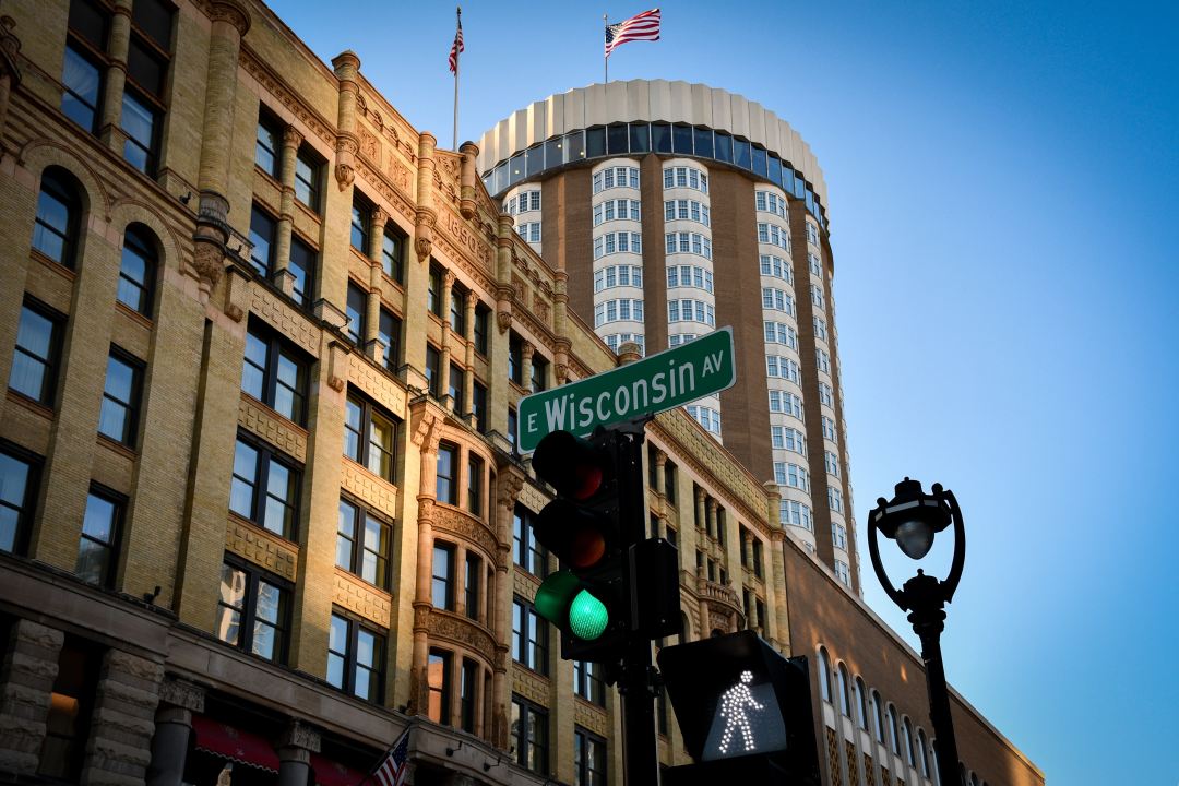 View of the Pfister Hotel from an East Wisconsin Avenue crosswalk in November 2022 (Casey Lovegrove/Unsplash)