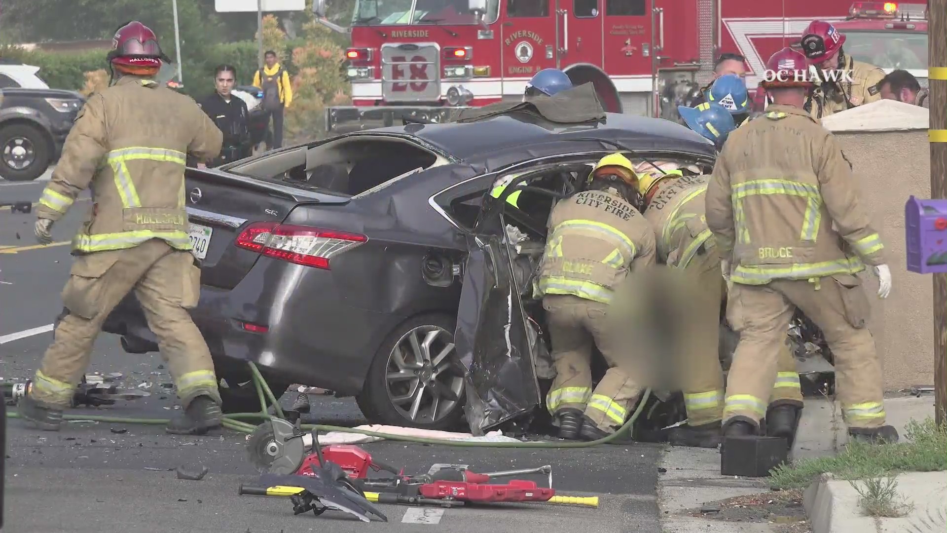 Video from the scene showed Riverside City Fire crews extricating the occupants of the Nissan after a deadly head-on crash in Riverside on May 16, 2023. (OC Hawk)