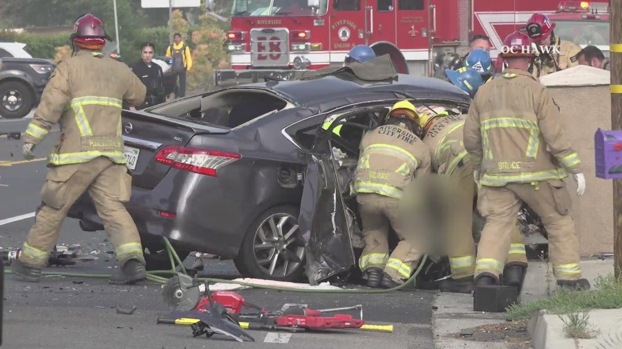 Video from the scene showed Riverside City Fire crews extricating the occupants of the Nissan after a deadly head-on crash in Riverside on May 16, 2023. (OC Hawk)