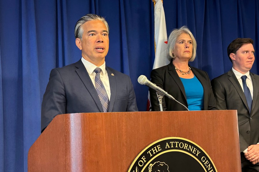California Attorney General Rob Bonta, left, speaks during a news conference in Sacramento, California, in this undated photo.
