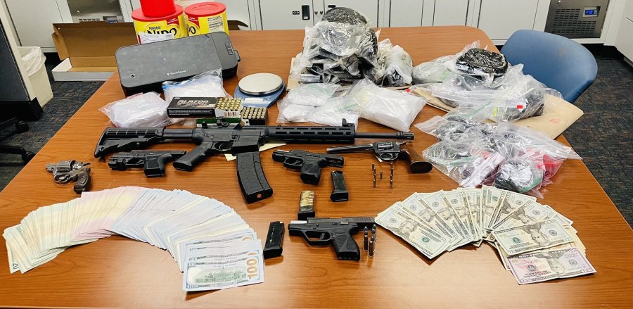 Authorities lay out a cache of items recovered from a search warrant service in Los Angeles. (Los Angeles Police Department)