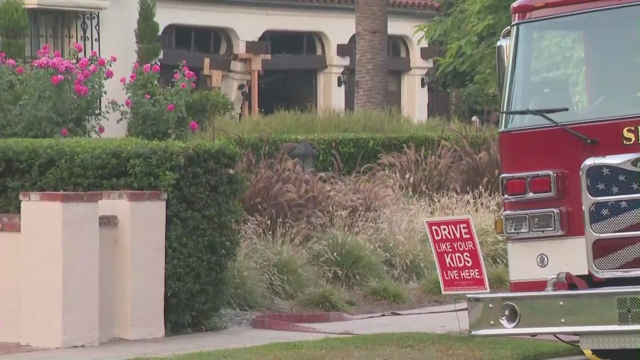 A sign in front of the home that sustained damage in the crash read “Drive like your kids live here.”