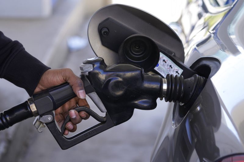 A motorist pumps gasoline at a Mobil gas station in West Hollywood, Calif., Friday, Feb. 25, 2022. (AP Photo/Damian Dovarganes)