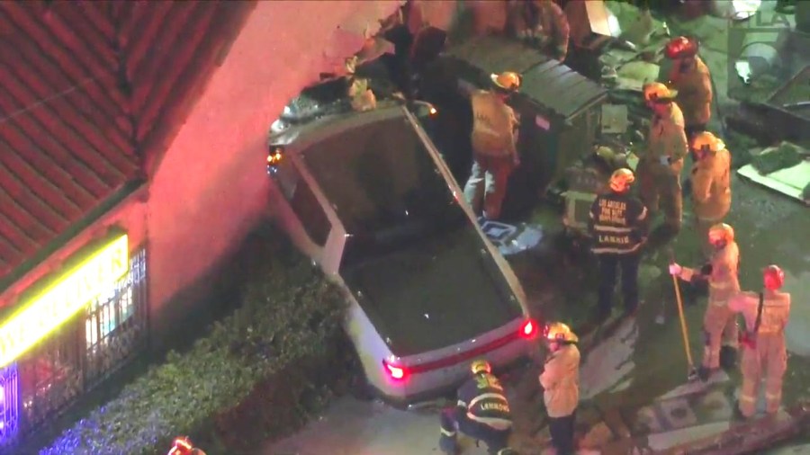 At least one person is hospitalized after a three-vehicle collision sent a truck crashing through a pizza shop in Hollywood on Oct. 31, 2023. (KTLA)