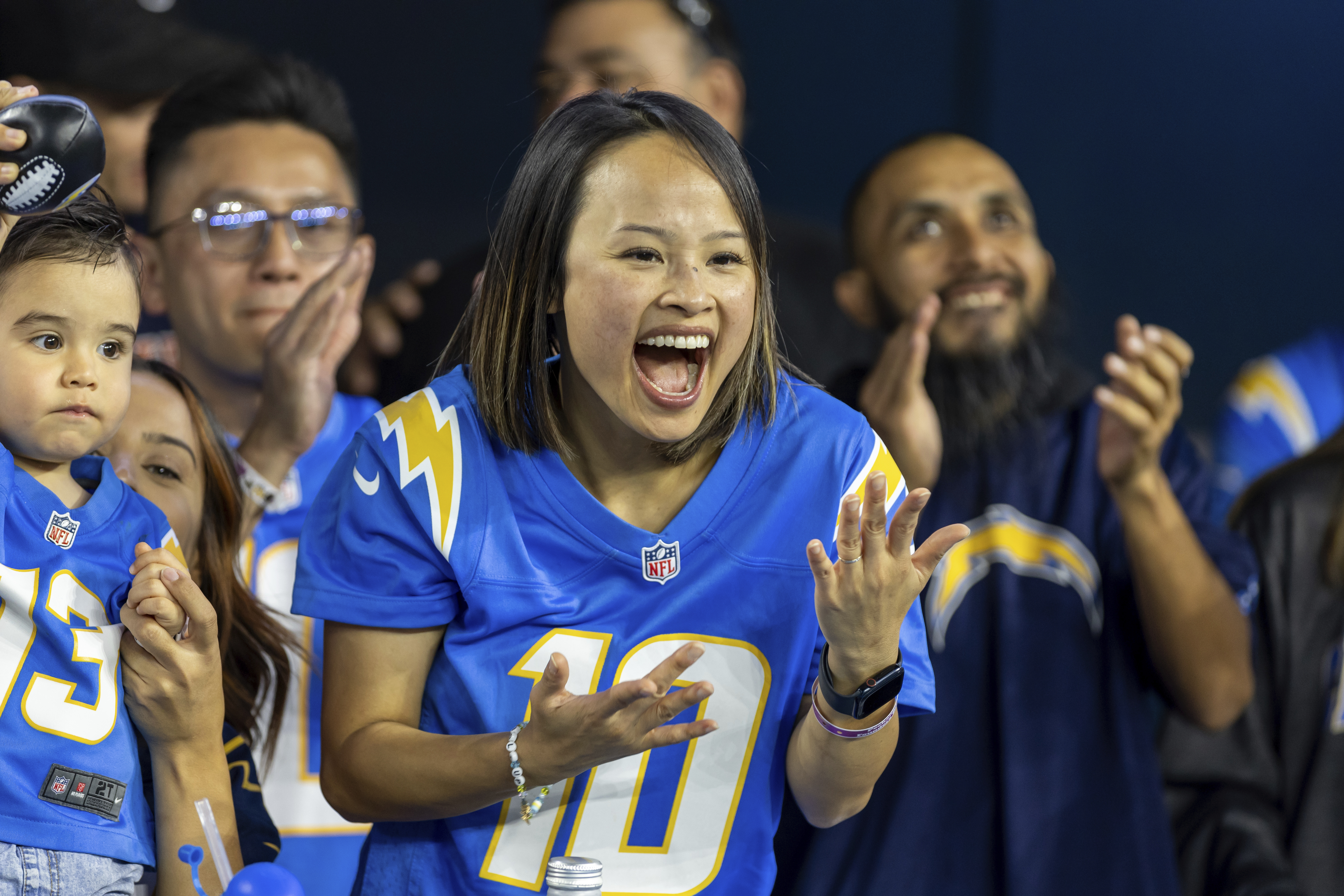 Los Angeles Chargers fan Merianne Do cheers for the Chargers while the Chargers play against the Chicago Bears in an NFL football game, Sunday, Oct. 29, 2023, in Inglewood, Calif. Chargers defeated the Bears 30-13. (AP Photo/Jeff Lewis)