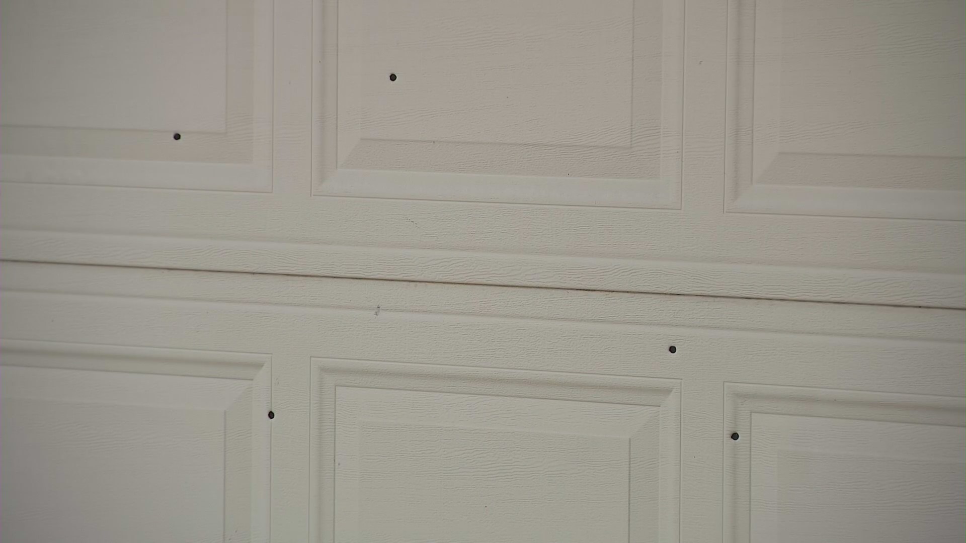 Bullet holes pictured on a home after Michael Rangel, a Riverside grandfather and veteran, was shot and killed on his front lawn on Oct. 28, 2023. (KTLA)