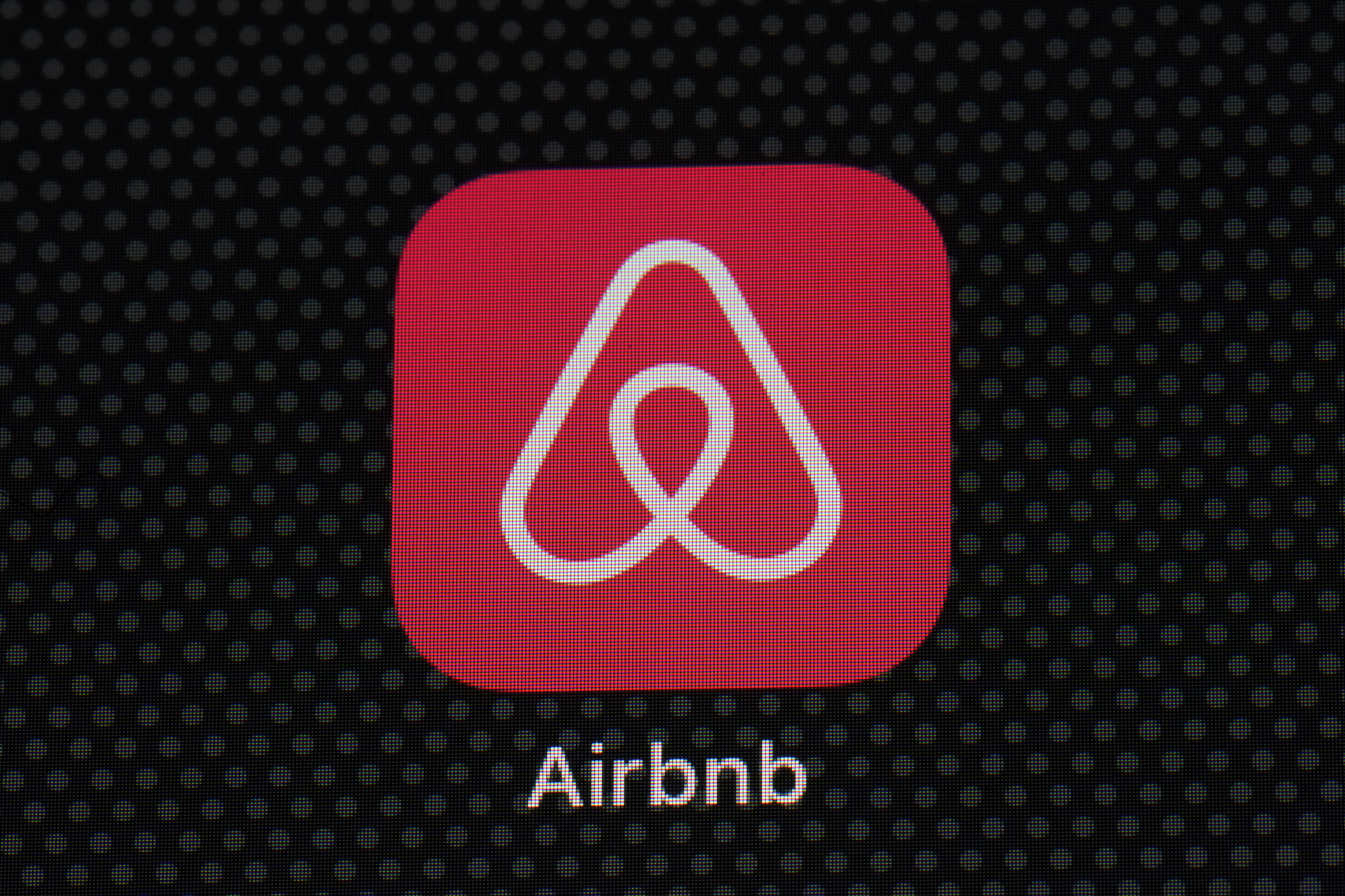 The Airbnb app icon is displayed on an iPad screen in Washington, D.C., on May 8, 2021. (AP Photo/Patrick Semansky, File)