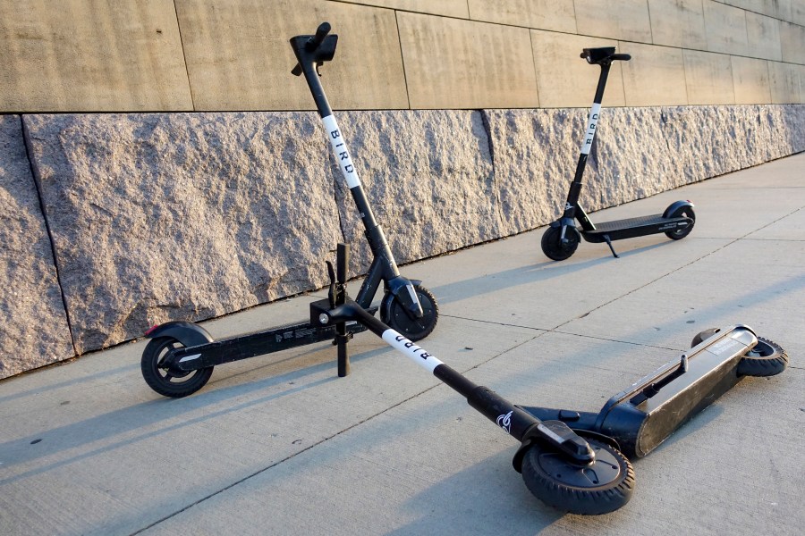 Sharable electric scooters by Bird Rides, Inc. wait on downtown sidewalks for pedestrian use, Oct. 2, 2019, in downtown Cincinnati. Electric scooter company Bird Global announced Wednesday, Dec. 20, 2023, that it has filed for bankruptcy protection in an attempt to stabilize its wobbly finances. (AP Photo/John Minchillo, File)