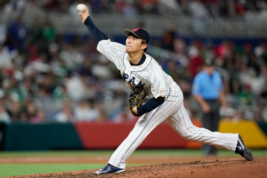FILE - Japan's Yoshinobu Yamamoto delivers a pitch during the fifth inning of a World Baseball Classic game against Mexico on March 20, 2023, in Miami. Yamamoto, the most prized pitcher on the free-agent market, has agreed to a $325 million, 12-year contract with the Los Angeles Dodgers, according to multiple reports. (AP Photo/Wilfredo Lee, File)