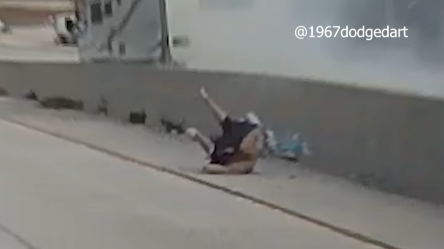 A man is seen on the 14 Freeway after an RV hit the center divider on Jan. 15, 2024.