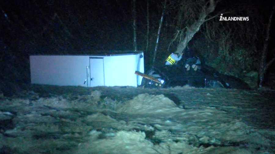 A swift water crew rescues three people trapped in rushing waters in the Cajon Pass on Feb. 5, 2024.