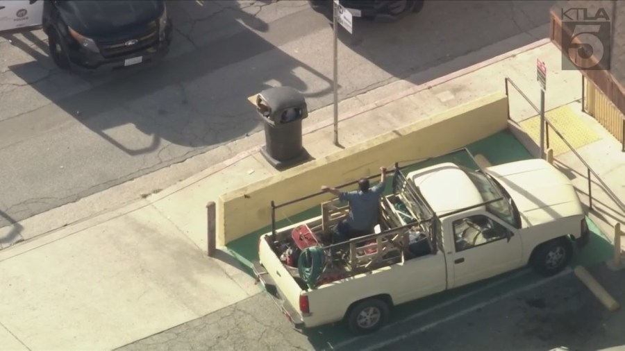 Chainsaw-wielding man surrenders after tense standoff