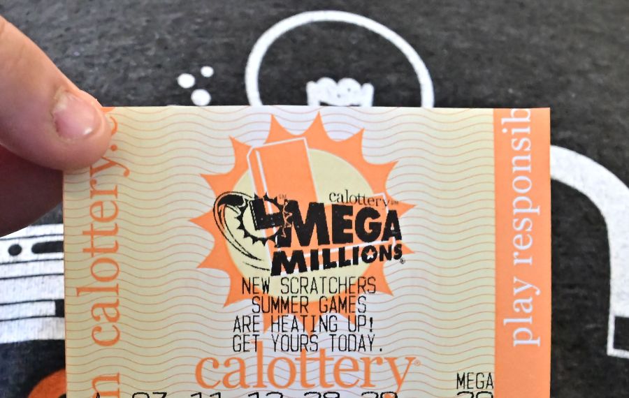 A Mega Millions lottery ticket is displayed in Los Angeles, California, on August 4, 2023. The sixth-largest jackpot in US history is up for grabs tonight after no tickets have been sold with all six numbers in the multi-state Mega Millions game for 30 consecutive draws. (Photo by Frederic J. BROWN / AFP) (Photo by FREDERIC J. BROWN/AFP via Getty Images)