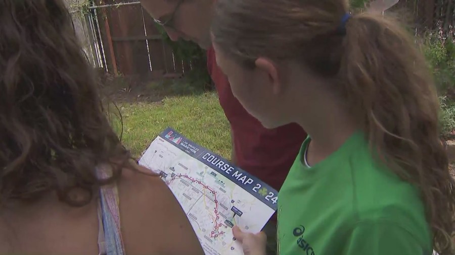 13-year-old Nyla Evans goes over the race route with her parents for the L.A. Marathon on March 16, 2024. (KTLA)