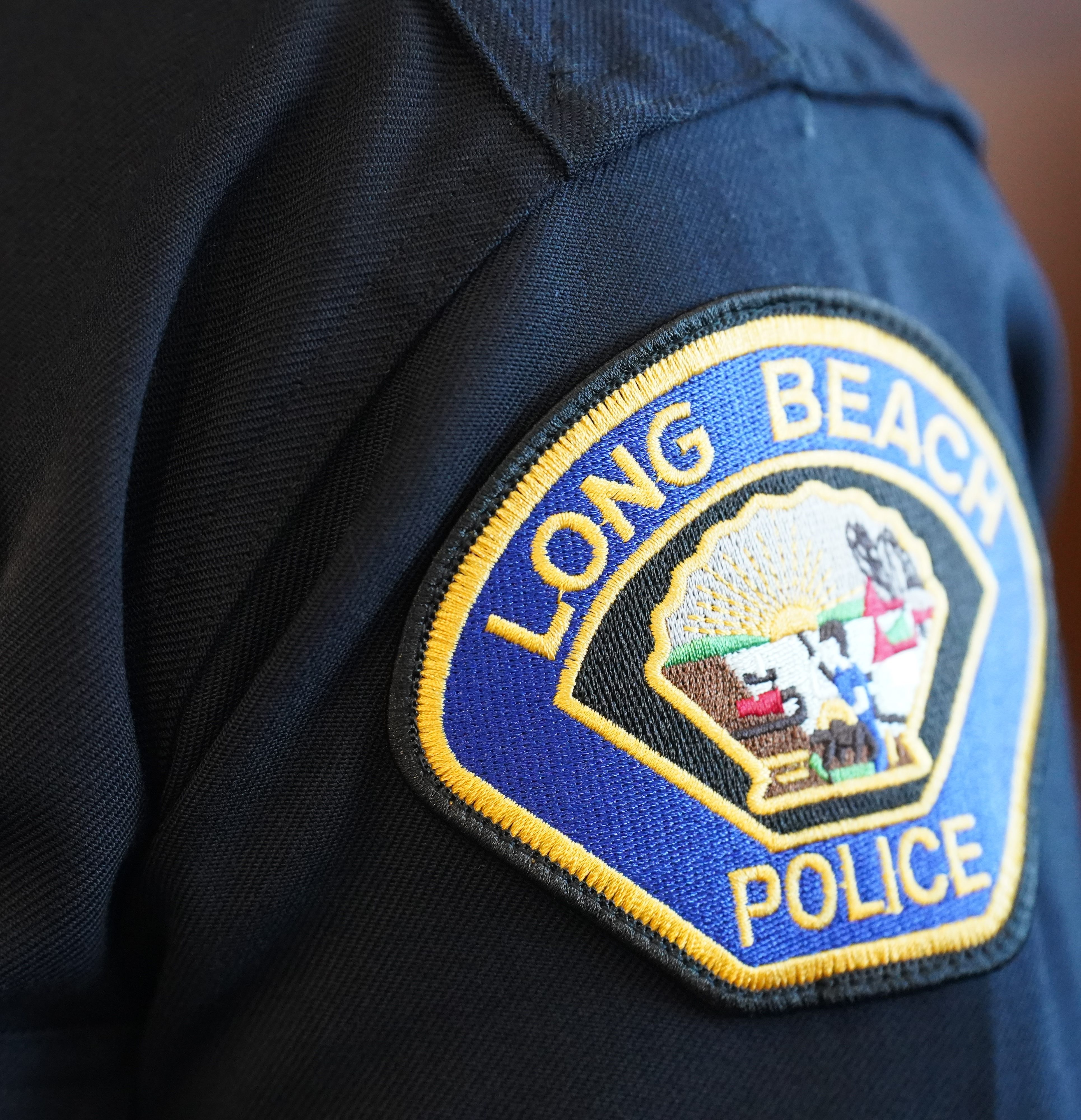 A Long Beach Police Department 'centennial badge' and patch are shown in this undated file image. (Long Beach Police Department)