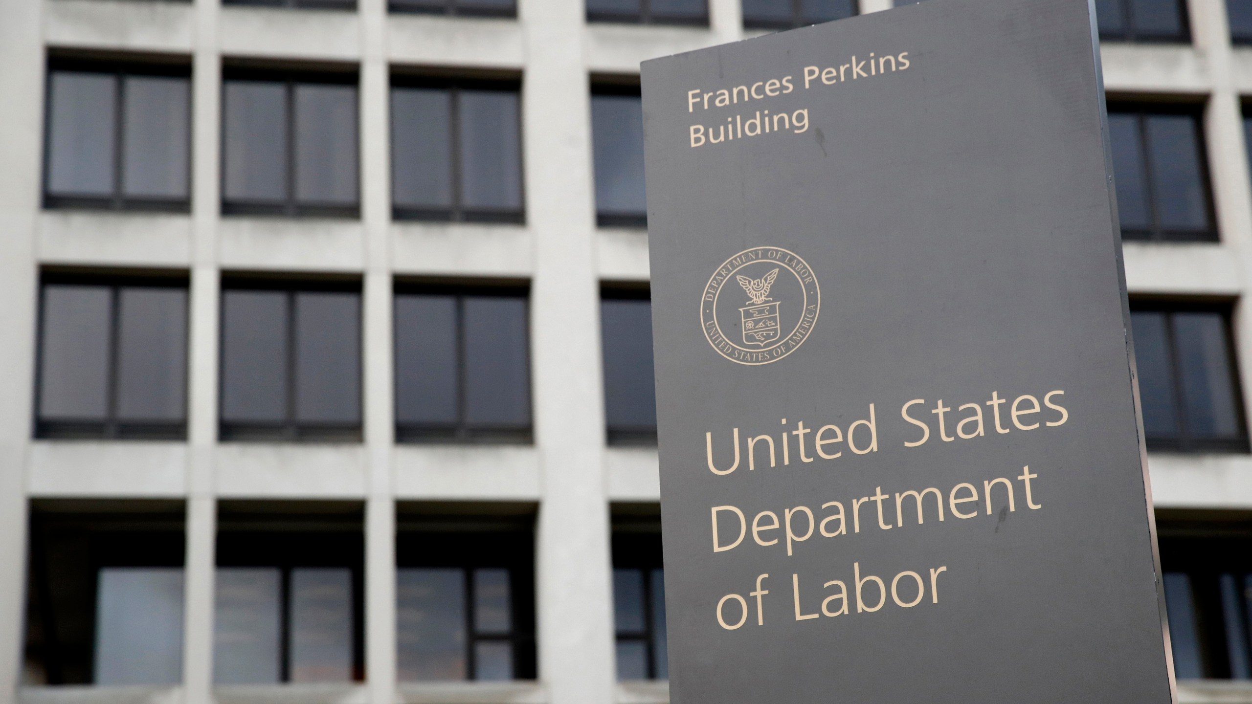 FILE - A sign stands outside the U.S. Department of Labor's headquarters, May 6, 2020, in Washington. The U.S. Department of Labor is asking a federal court to prevent Hyundai and two other Alabama companies from employing children illegally. (AP Photo/Patrick Semansky, File)