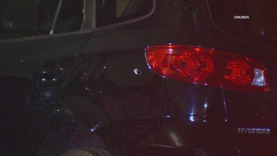 Bullet holes can be seen on the victims' vehicle. (KNN)