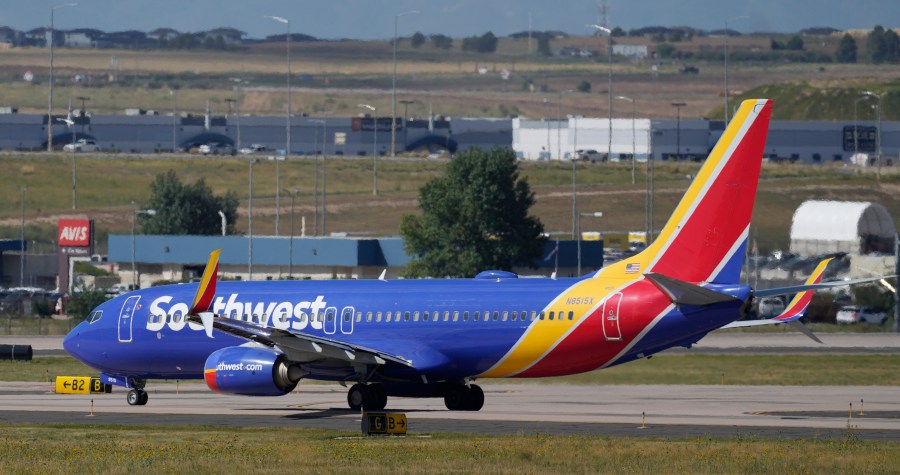 A Southwest Airlines jetliner waits on a runway for departure from Denver International Airport Friday, Sept. 1, 2023. (AP Photo/David Zalubowski, File)