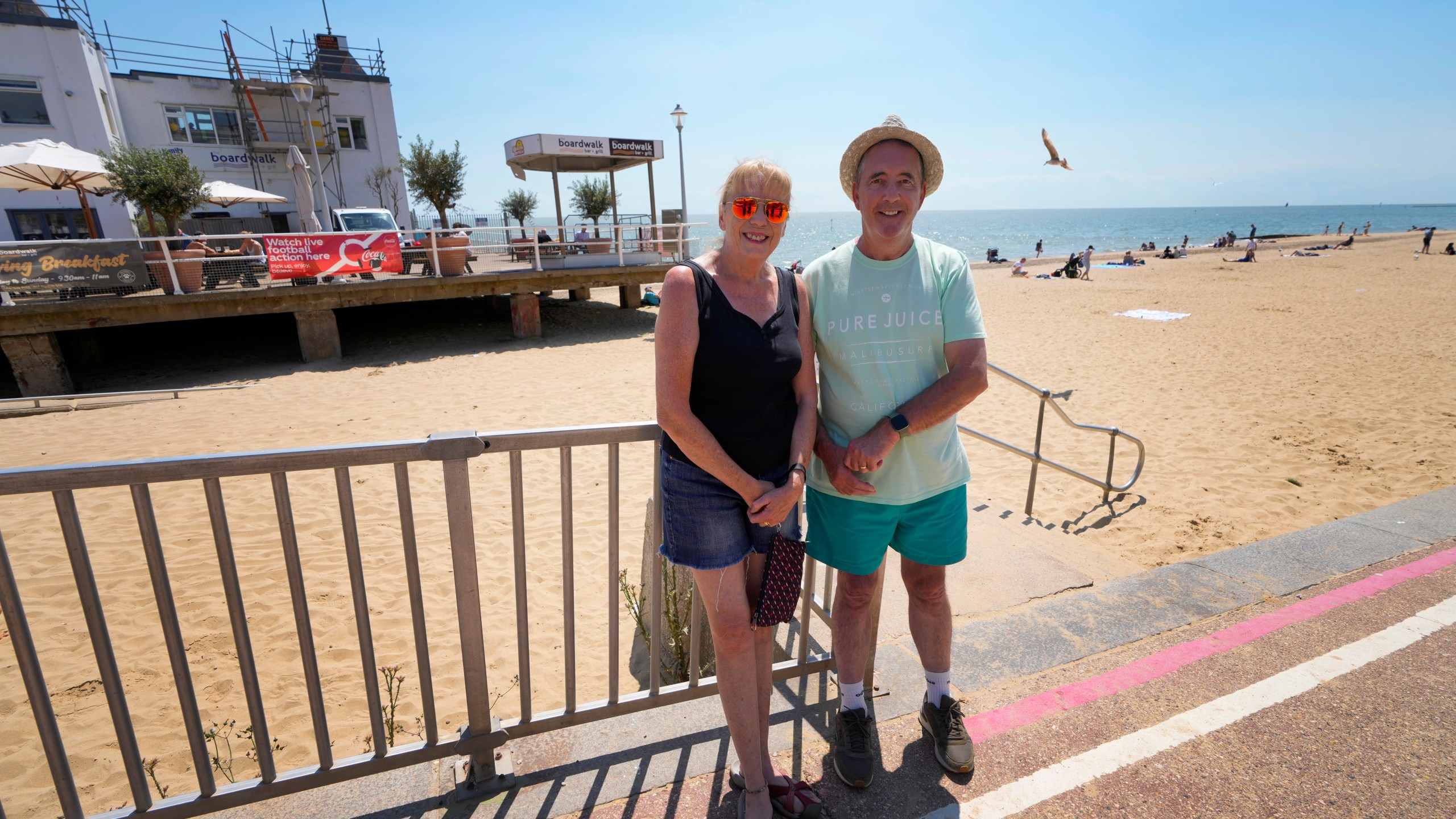 Voters Janet and Sean Clancy stand in Clacton-On-Sea, England, Friday, June 21, 2024. Like many others in the seaside town, they feel a deep sense of disillusionment with the governing Conservatives. Instead, they will vote for the anti-immigration Reform UK party in next week's national election. (AP Photo/Kirsty Wigglesworth)